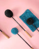 ollihess Bestseller: Gong Mallets mit schwarzen und petrolfarbenen Köpfen auf rosa Hintergrund
